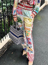 Pantalones anchos con bolsillos y cintura elástica con estampado único